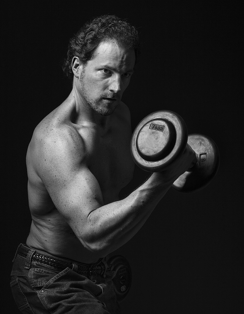Dave Barnas, author from True Health Unlimited, attempting to build some biceps. 