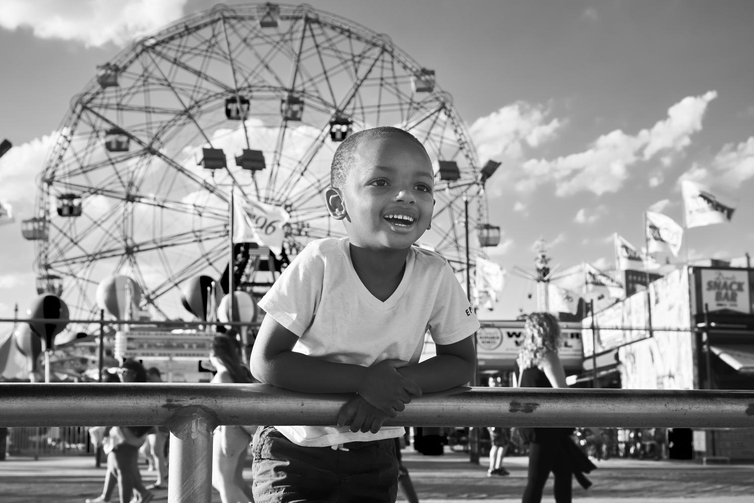 Young boy enjoys Coney Island. Photopgraph by Joel Davidson.